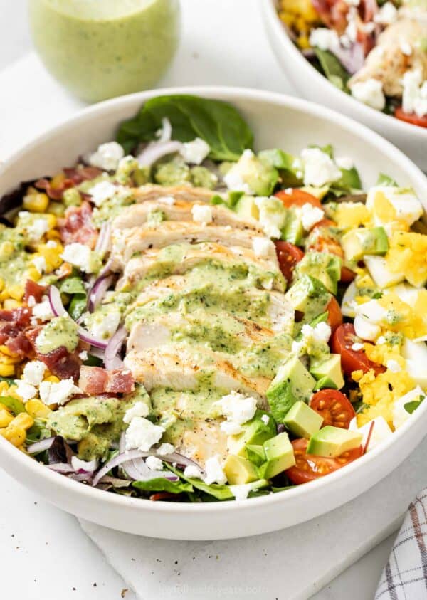 Chicken Cobb salad in bowl with creamy poblabo dressing