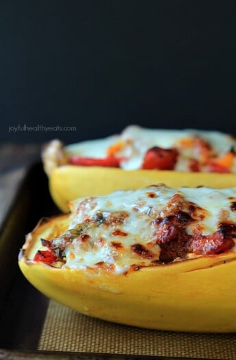 An easy healthy spanish inspired weeknight dinner, Chorizo Kale & Pepper Stuffed Spaghetti Squash Boats! | www.joyfulhealthyeats.com