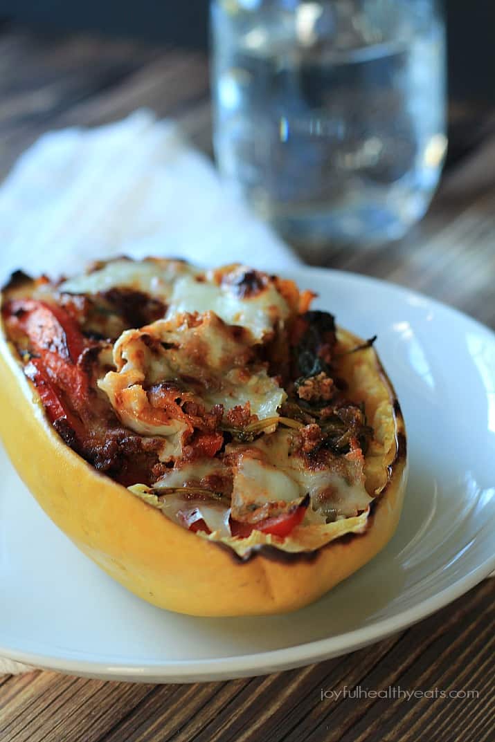 A Chorizo Kale & Pepper Stuffed Spaghetti Squash Boat on a plate