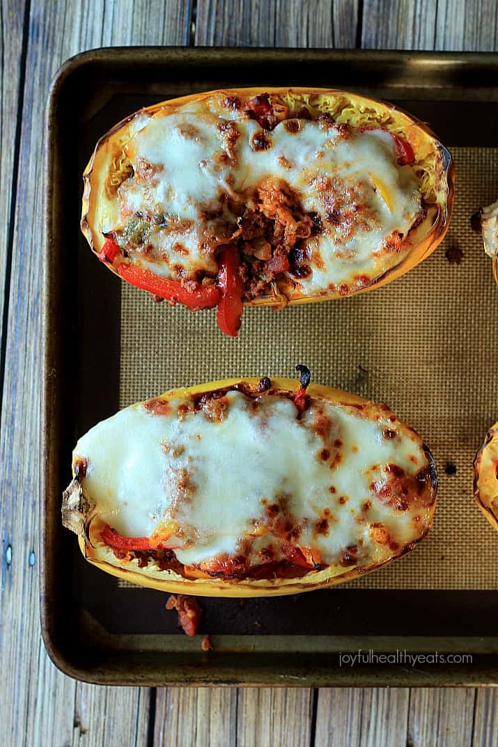 Top view of Chorizo Kale & Pepper Stuffed Spaghetti Squash Boats on a baking sheet