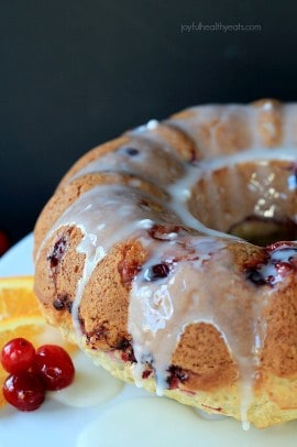 A fresh tart Cranberry Orange Bundt Cake topped with a sweet Orange Glaze! Its the perfect dessert recipe for the holidays. | www.joyfulhealthyeats.com