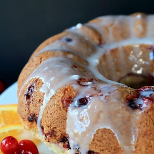 A Fresh Cranberry Orange Bundt Cake Topped with Orange Glaze