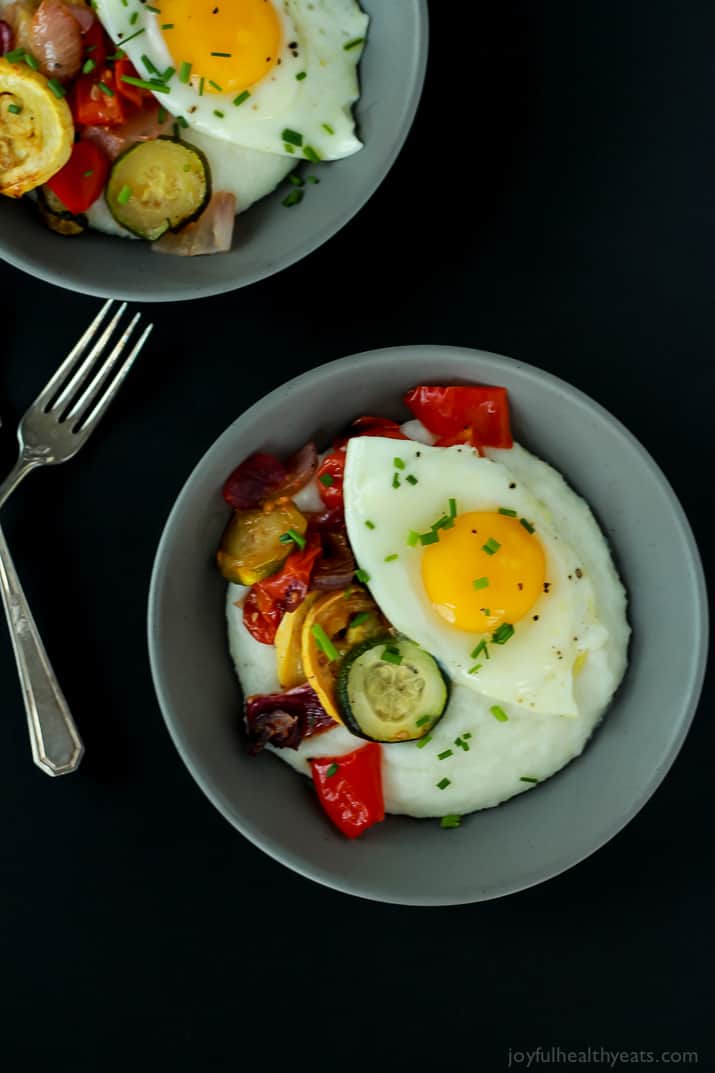 Two Gray Bowls of Grits, Eggs and Veggies with Silverware