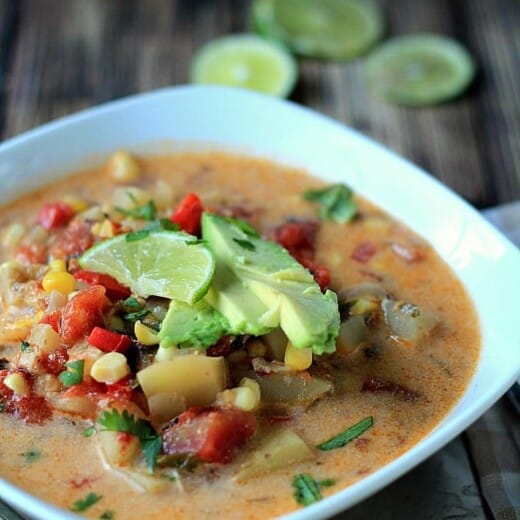 A Bowl of Crock Pot Southwestern Corn & Potato Chowder with Lime Slices