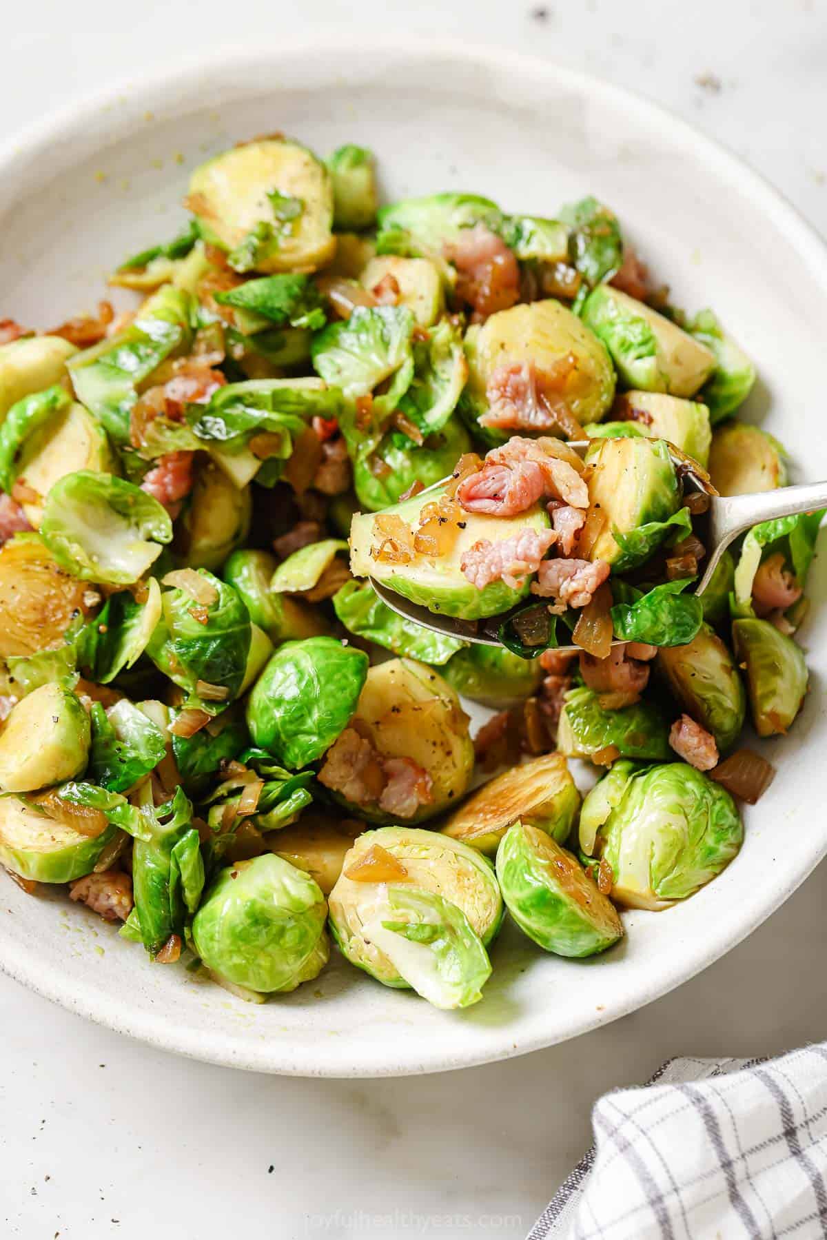 Sauteed brussels sprouts with caramelized onions and bacon. 