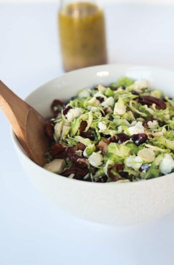 You need this Salad in your life & on the table! Shaved Brussels Sprouts Harvest Salad with Hard Apple Cider Vinaigrette | www.joyfulhealthyeats.com #thanksgiving #healthy