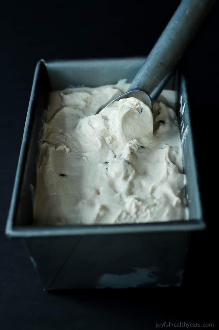 A Metal Scoop Scooping Up a Serving of Espresso Ice Cream