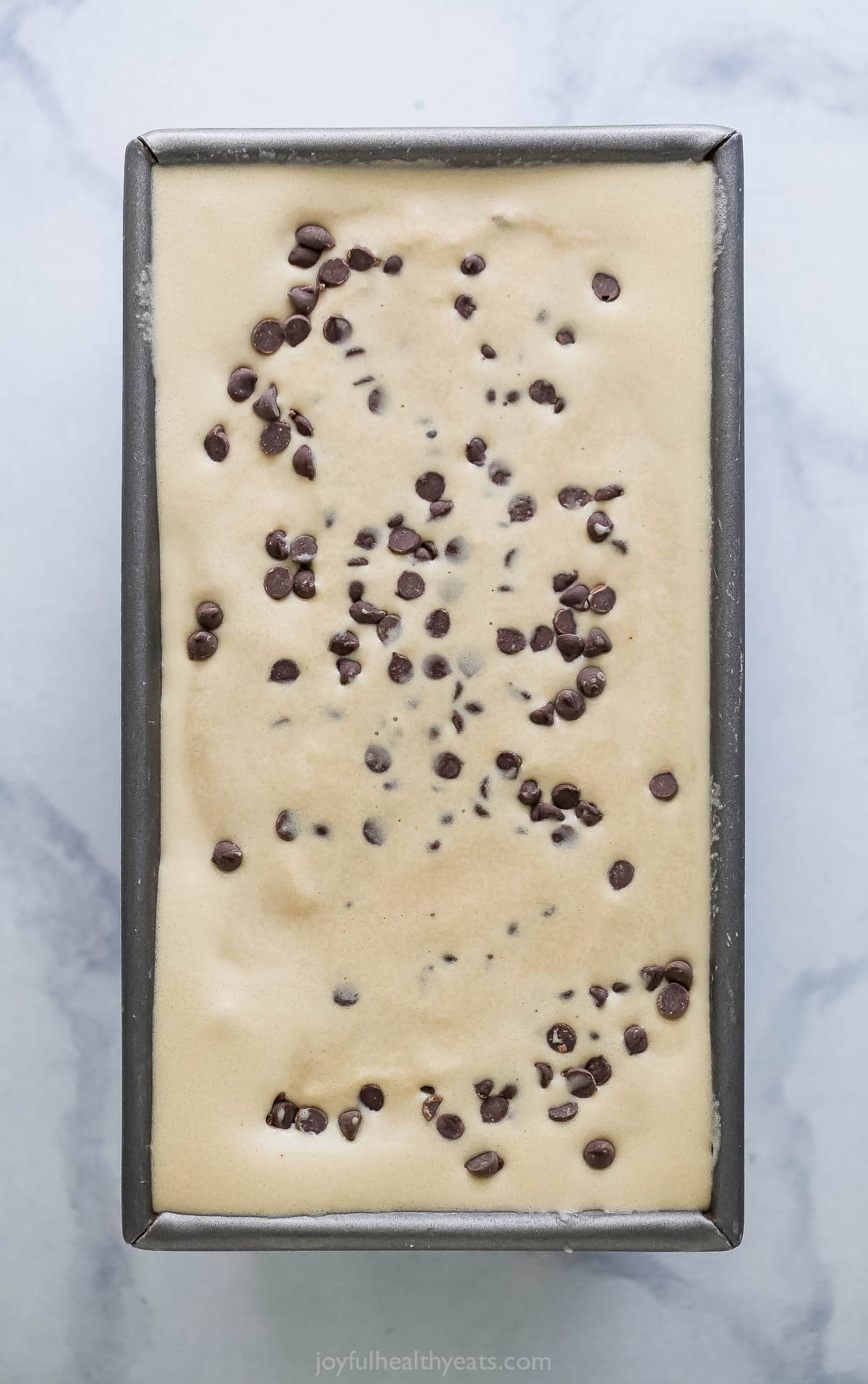 Espresso chocolate chip ice cream in loaf pan before freezing