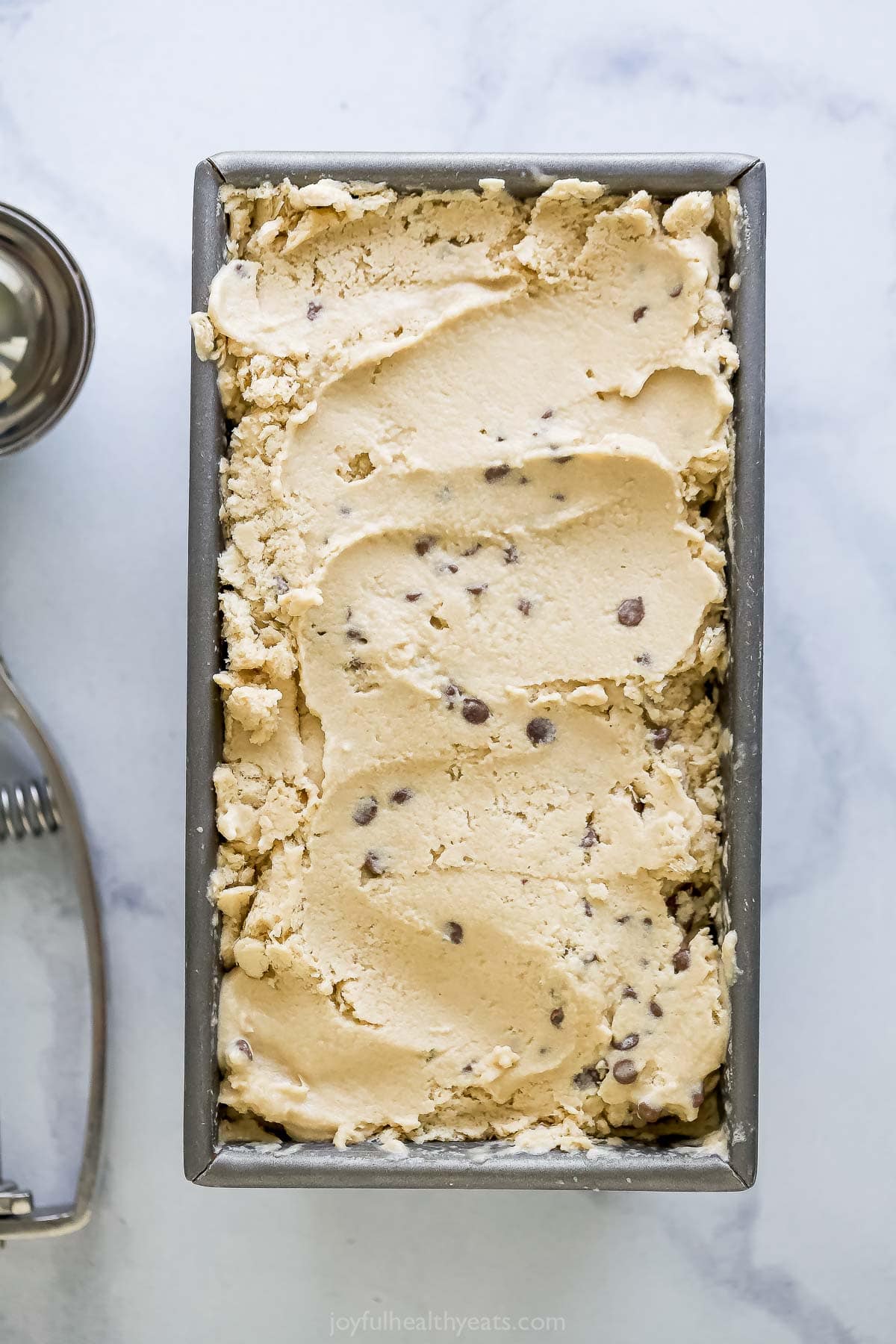 Espresso ice cream with chocolate chips frozen in loaf pan