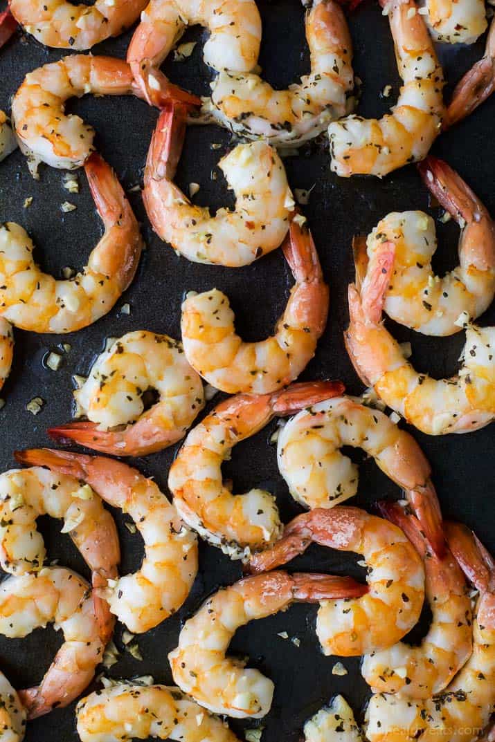 Top view of Garlic Herb Roasted Shrimp on a baking sheet