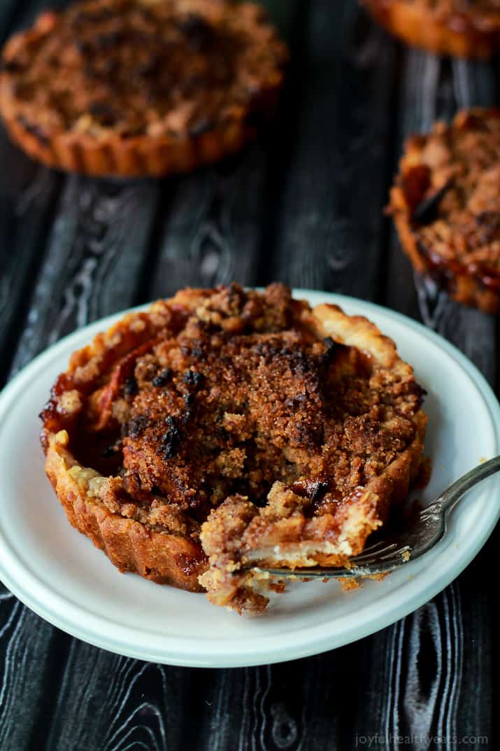 Built in portion control makes these Mini Apple Pie Tartlets with Pecan Streusel extra irresistible! The ultimate fall dessert! | www.joyfulhealthyeats.com 