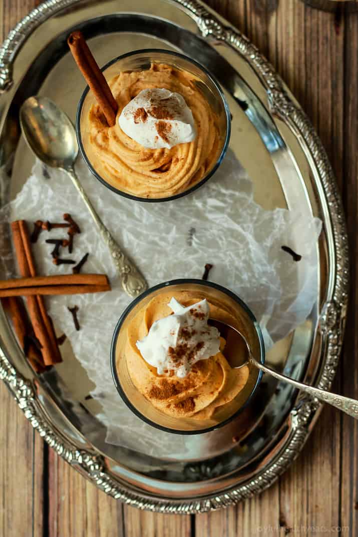 Two Homemade Thanksgiving Cheesecakes with Cool Whip and Cinnamon on Top