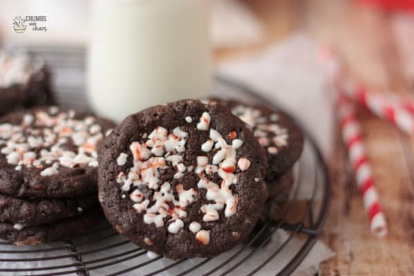 Peppermint Chocolate Chipster Cookies on a Cooling Rack Beside a Glass of Milk