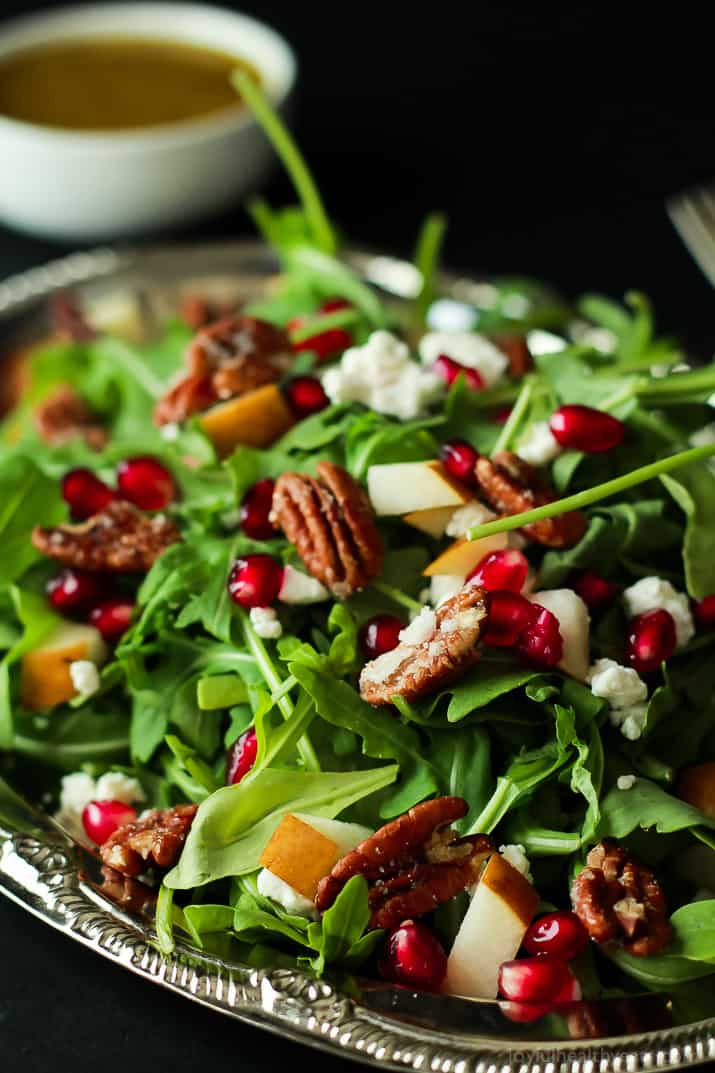 Pomegranate Goat Cheese Candied Pecan Arugula Salad. The perfect salad to change up your holiday menu, easy to make and absolutely delicious! | www.joyfulhealthyeats.com