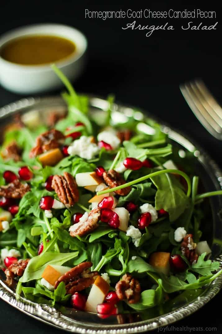 Pomegranate Goat Cheese Candied Pecan Arugula Salad. The perfect salad to change up your holiday menu, easy to make and absolutely delicious! | www.joyfulhealthyeats.com