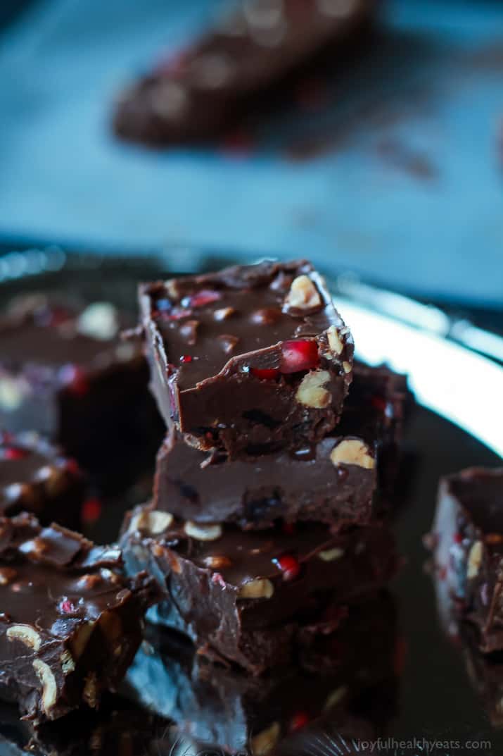 A guilt free holiday classic made "skinny"! This Dark Chocolate Pomegranate Hazelnut Fudge is seriously so good, you need to make it! | www.joyfulhealthyeats.com