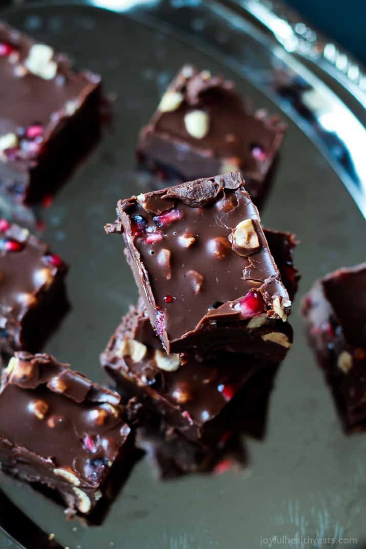 A guilt free holiday classic made "skinny"! This Dark Chocolate Pomegranate Hazelnut Fudge is seriously so good, you need to make it! | www.joyfulhealthyeats.com