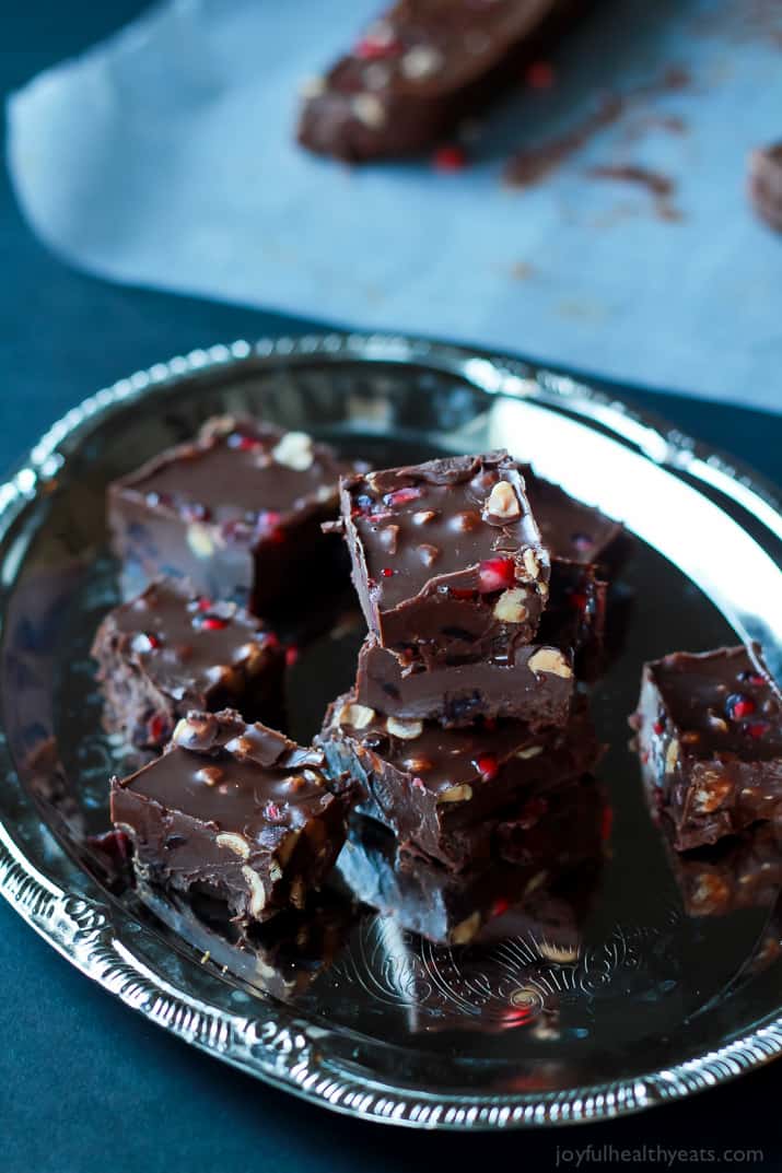 A guilt free holiday classic made "skinny"! This Dark Chocolate Pomegranate Hazelnut Fudge is seriously so good, you need to make it! | www.joyfulhealthyeats.com