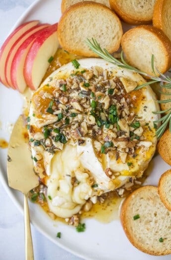 Baked brie with fig jam and baguette slices.