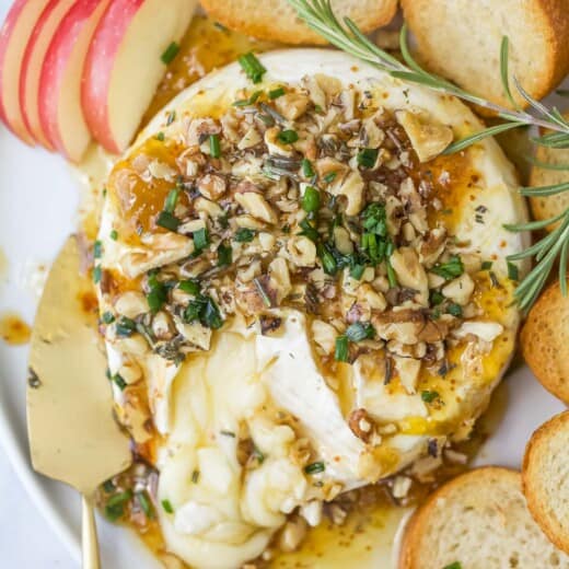 Baked brie with fig jam and baguette slices.