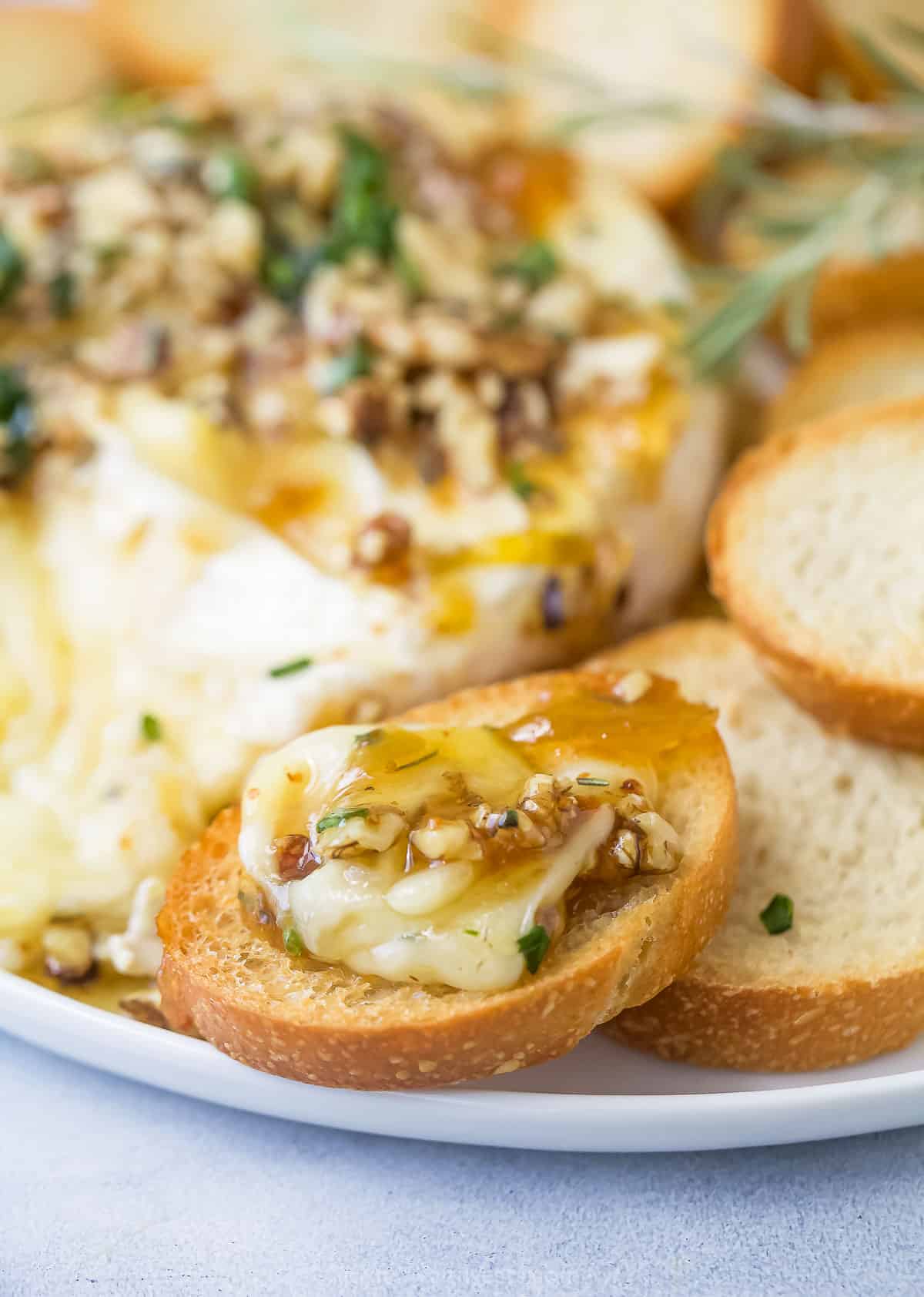 Melty brie on a toasted baguette slice.
