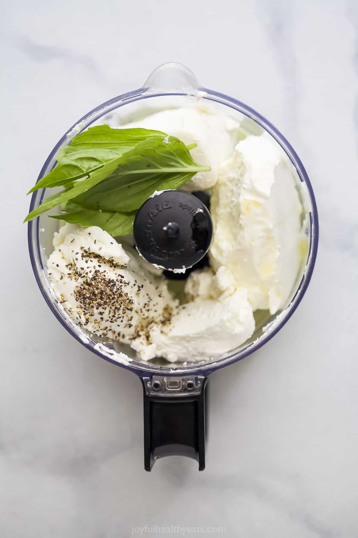 Adding the base ingredients to the food processor.