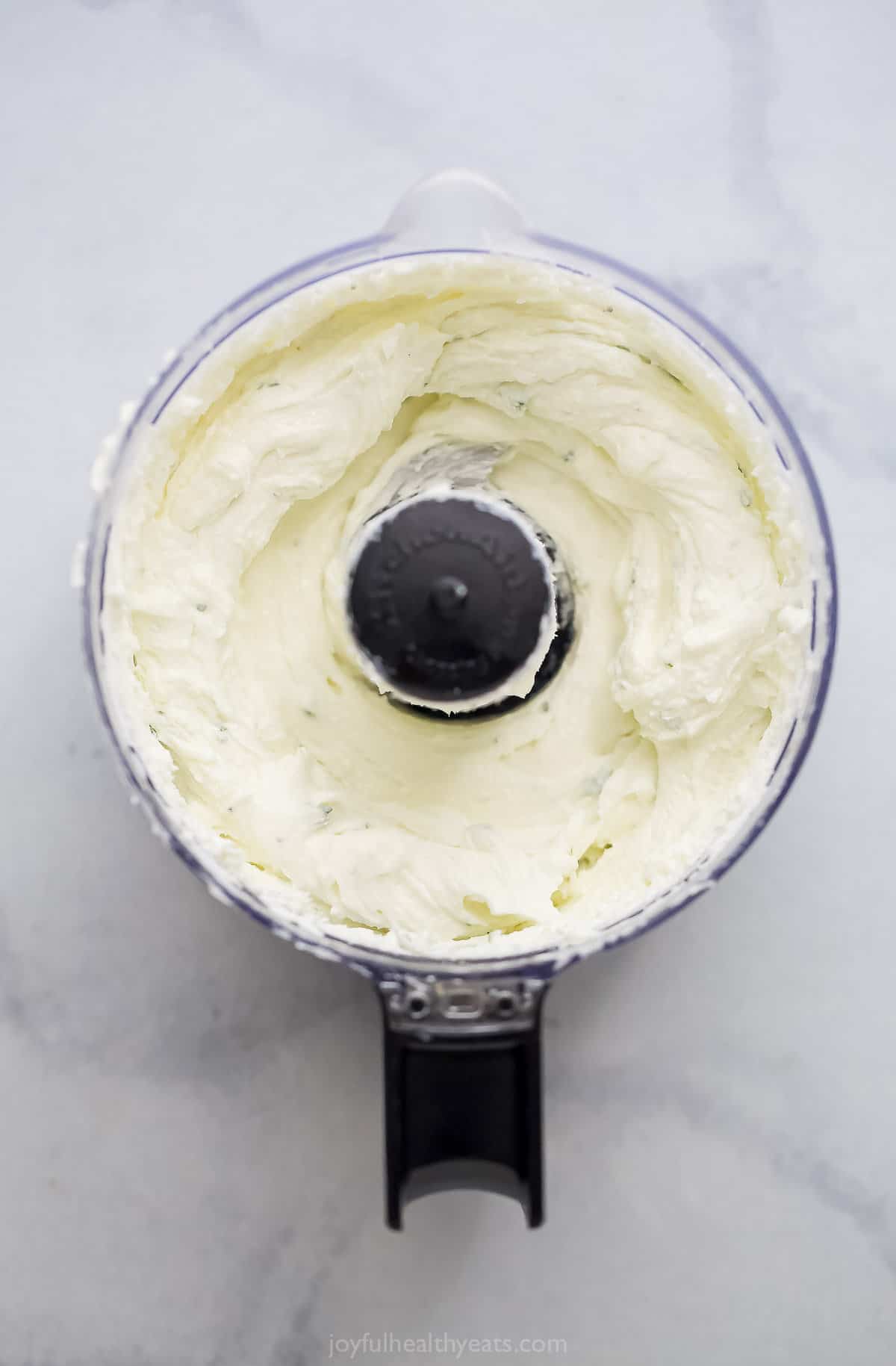 Creamy cheese mixture in the food processor.