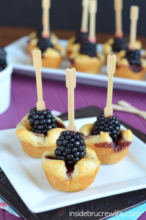Three Blackberry Brie Bites on a Square Plate