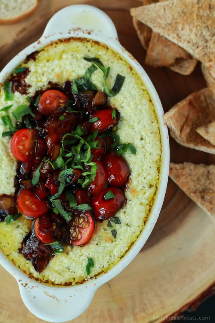 Top view of Baked Goat Cheese Dip topped with balsamic bruschetta