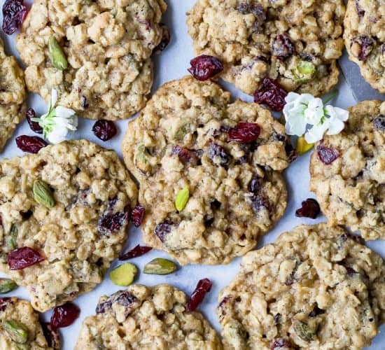 photo of Chewy Pistachio Cranberry Oatmeal Cookies on parchment paper