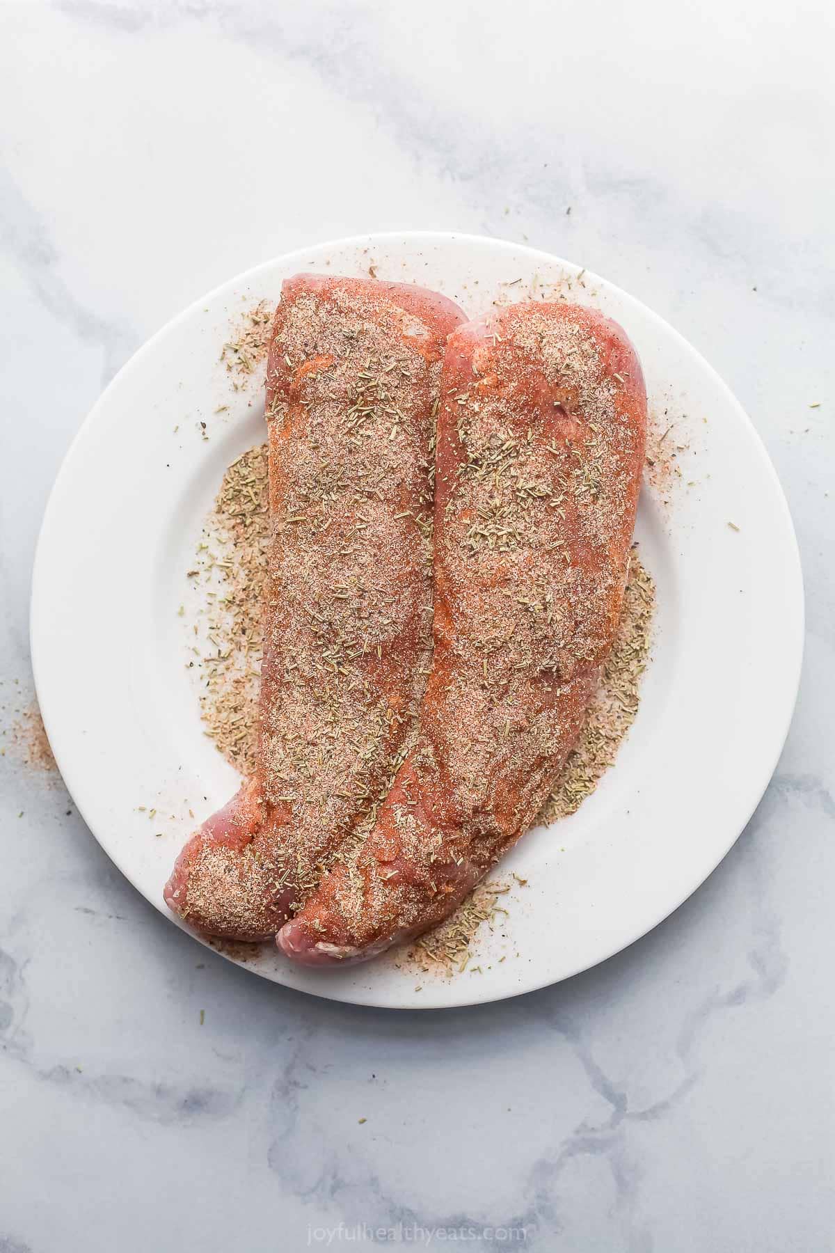 Seasoned pork on plate.