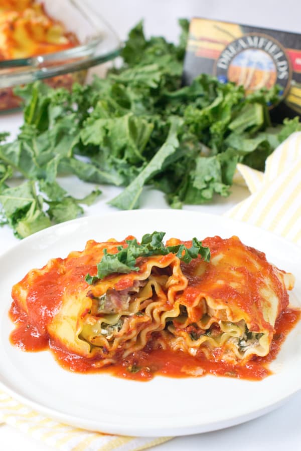 A Plate of Lasagna Rolls with Chicken Cordon Bleu and Kale Filling