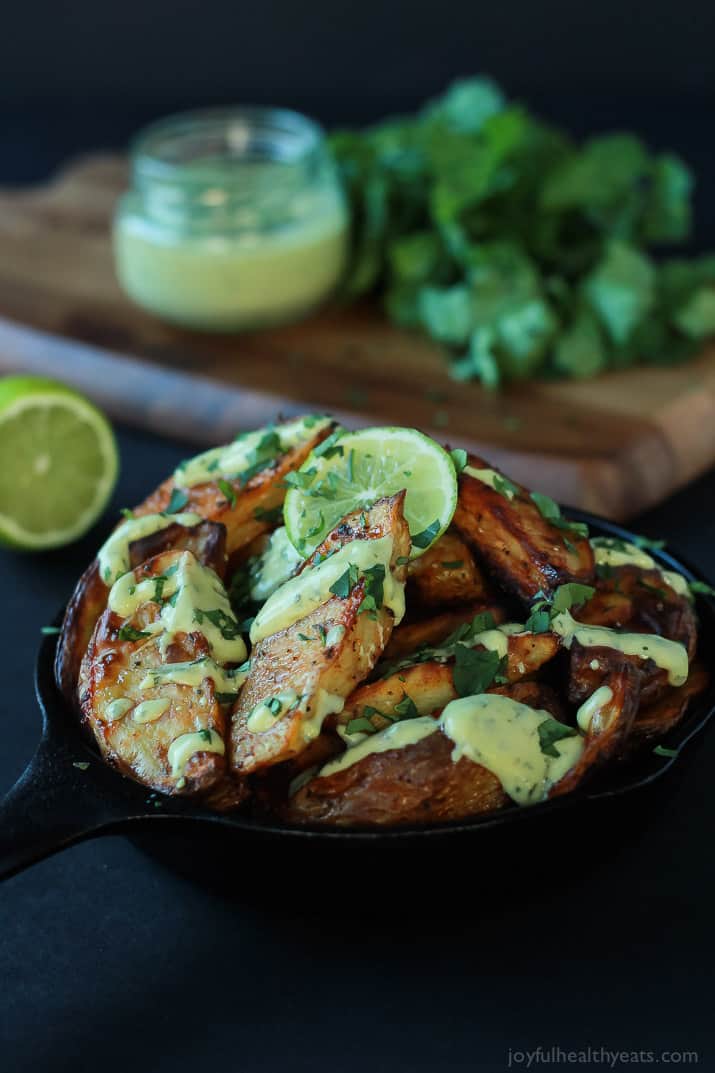 These Oven Roasted Potato Wedges actually turn out crispy, and the Avocado Wasabi Aioli rocks! | www.joyfulhealthyeats.com #recipes 