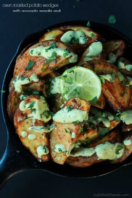 Oven Roasted Potato Wedges with Avocado Wasabi Aioli in a cast iron skillet