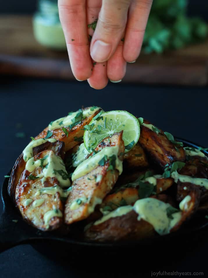 These Oven Roasted Potato Wedges actually turn out crispy, and the Avocado Wasabi Aioli rocks! | www.joyfulhealthyeats.com #recipes 