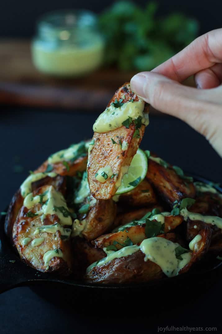 These Oven Roasted Potato Wedges actually turn out crispy, and the Avocado Wasabi Aioli rocks! | www.joyfulhealthyeats.com #recipes 