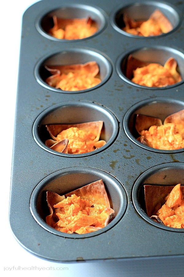 Skinny Buffalo Chicken Wonton Cups in a baking pan