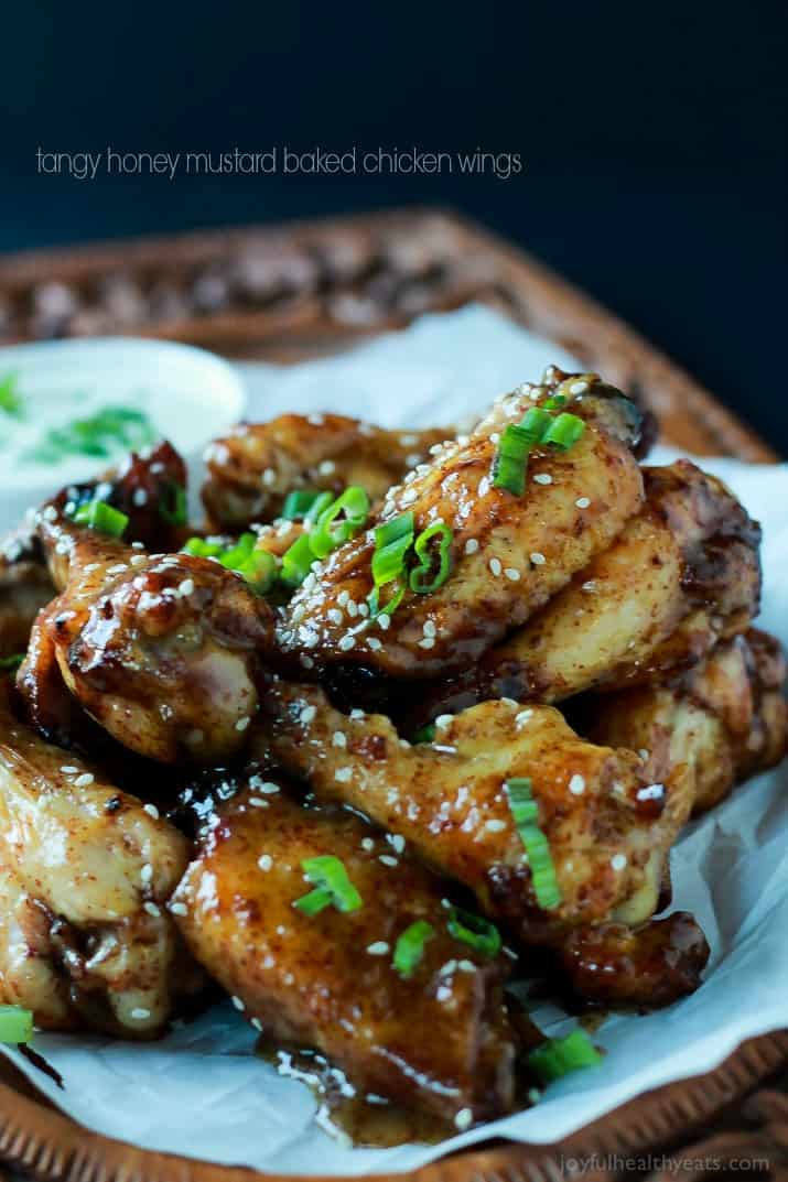 The BEST sauce ever and only for 4 ingredients, this is a must make! Tangy Honey Mustard Baked Chicken Wings | www.joyfulhealthyeats.com #appetizer #recipes