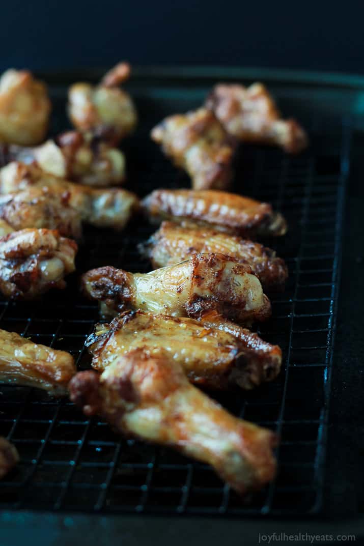 Baked chicken wings on a grill rack
