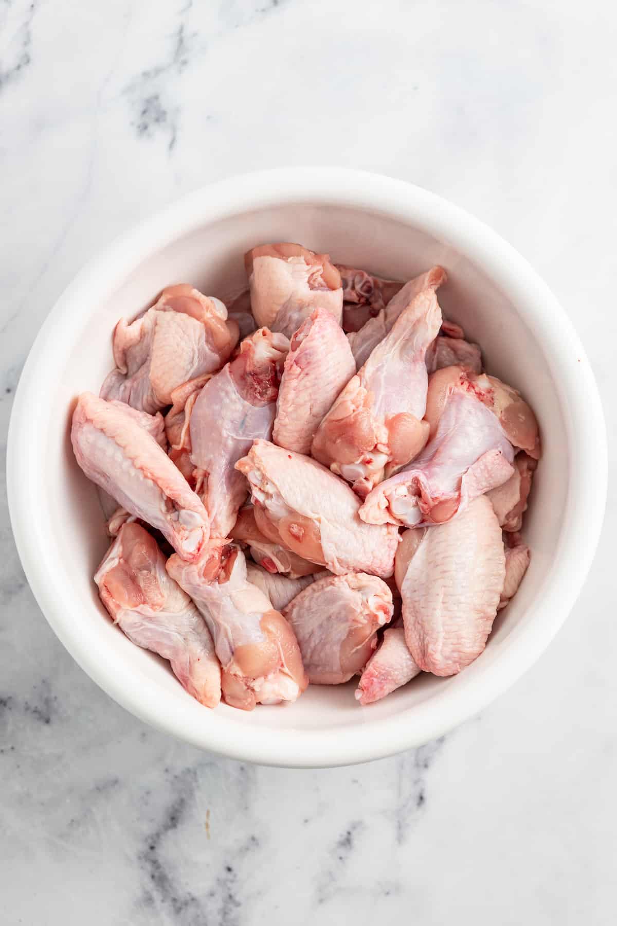 raw chicken wings in a bowl