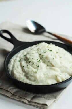 Cauliflower Alfredo Sauce in a Skillet on Top of a Cloth Napkin