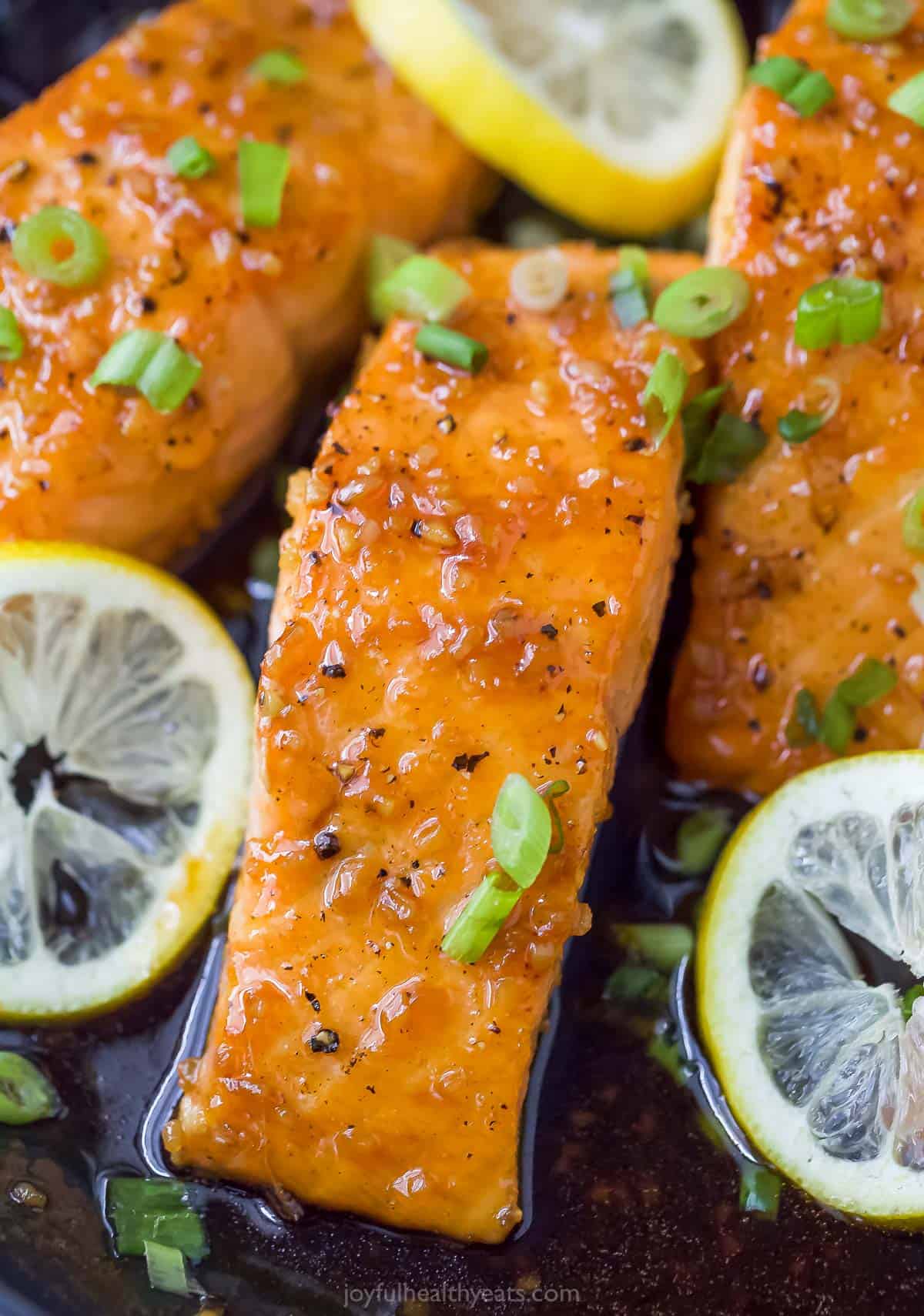 Close-up of a honey glazed filled with lemon slices on top. 