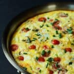 A Cheesy Bacon Spinach Frittata done in 30 minutes! This Spinach Frittata is packed with goat cheese, roasted red peppers, and bacon! Perfect for Brunch! | joyfulhealthyeats.com #easter #mothersday #recipes