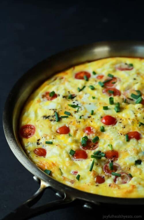 A Cheesy Bacon Spinach Frittata done in 30 minutes! This Spinach Frittata is packed with goat cheese, roasted red peppers, and bacon! Perfect for Brunch! | joyfulhealthyeats.com #easter #mothersday #recipes