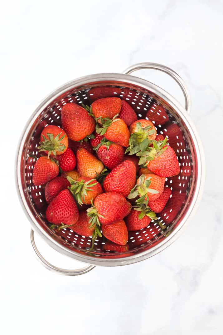 fresh strawberries in a colander