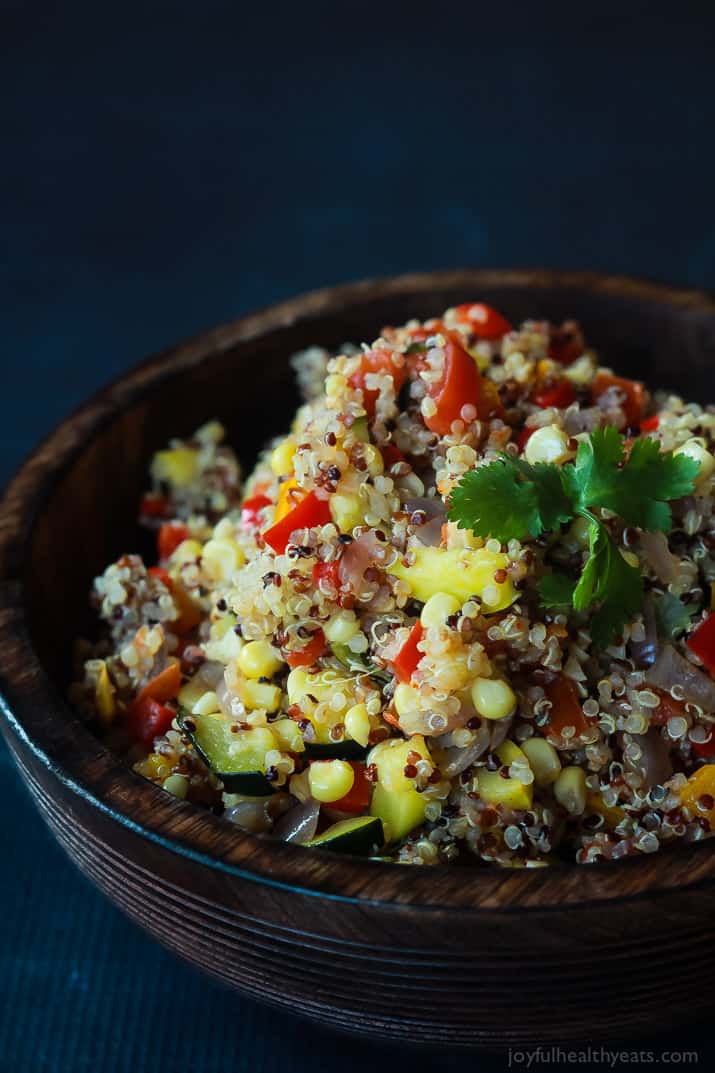 A heart healthy Southwestern Roasted Vegetable Quinoa Salad packed with protein and loads of flavor then topped with a poached egg and fresh avocado! Holy Yum! | joyfulhealthyeats.com #recipes