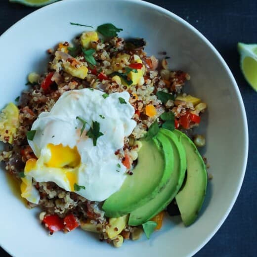 A Southwestern Roasted Vegetable Quinoa Salad in a Bowl with a Poached Egg