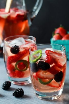 A fresh light Strawberry Jalapeno White Sangria recipe with pomegranate juice and mixed berries. It has everything your taste buds want sweet, spicy ,and fruity! | joyfulhealthyeats.com #recipes #cocktail