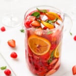 Pitcher of strawberry sangria with ice.
