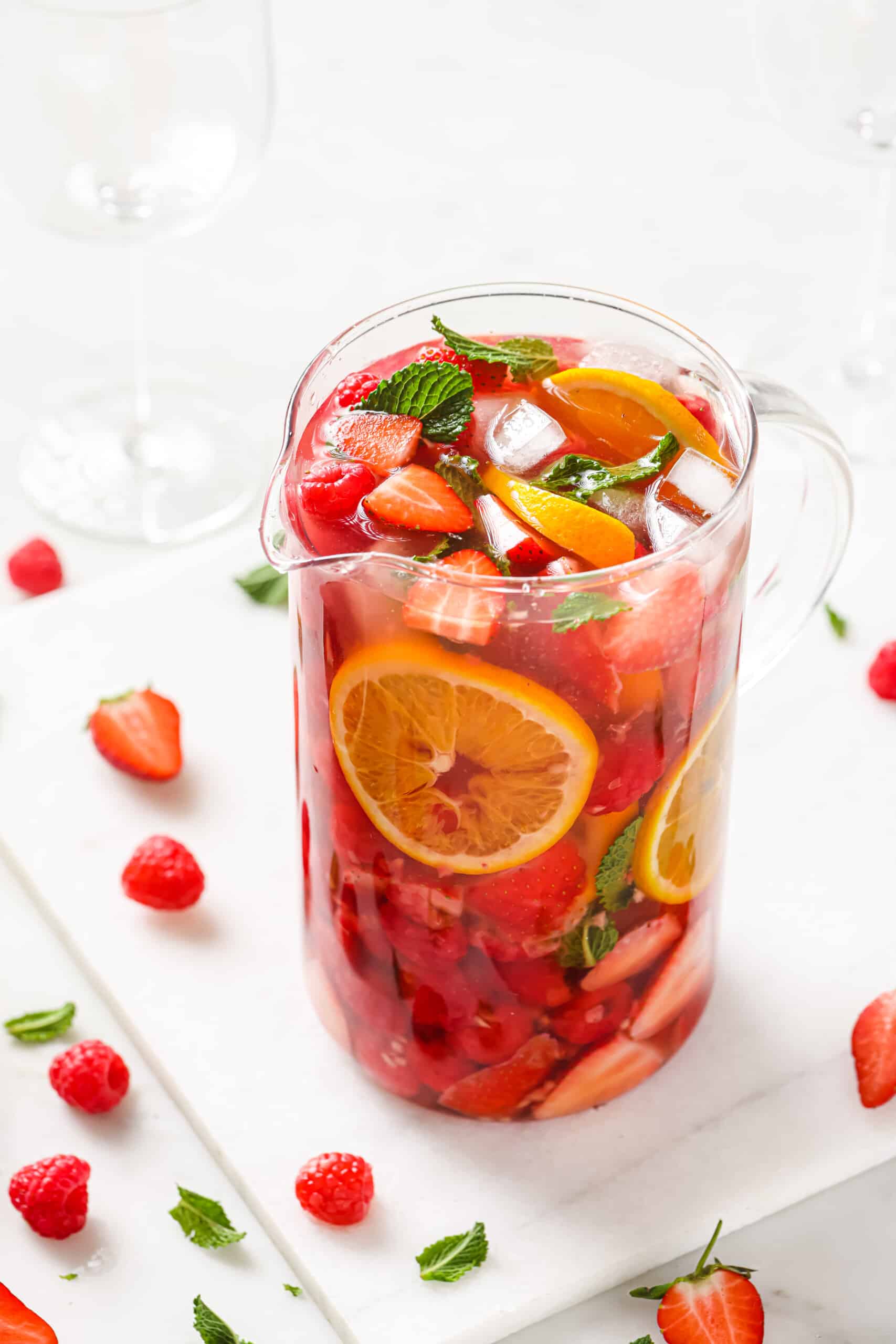 Pitcher of strawberry sangria with ice.